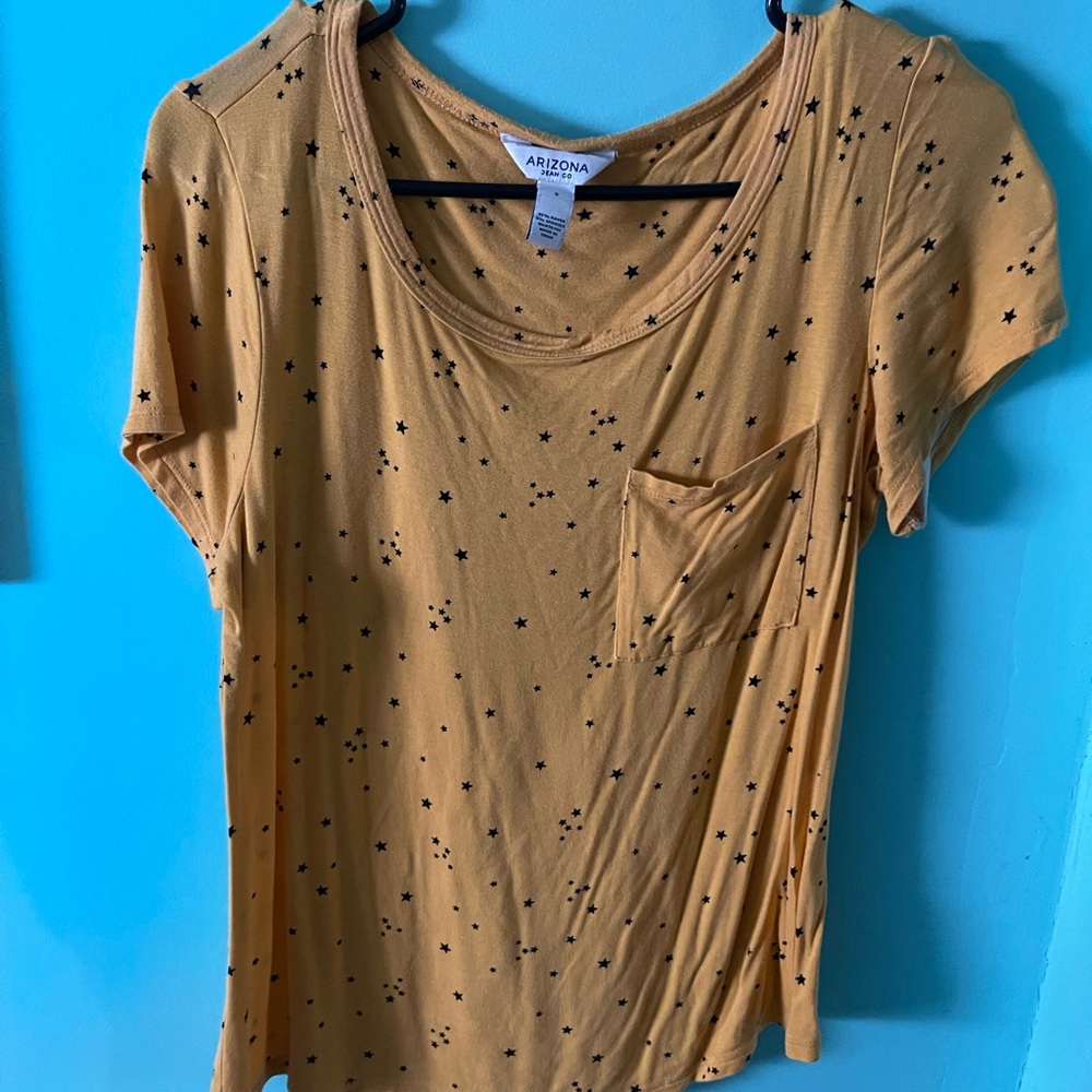 Yellow shirt with black stars